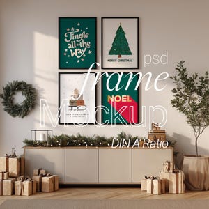 May include: A room decorated for Christmas with framed art, a wreath, and wrapped gifts. The art includes a green Christmas tree, the words "Jingle all the way", and the word "NOEL". A plant in a woven pot is on the right.
