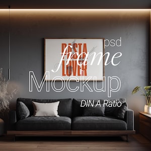May include: A contemporary living room featuring a dark grey sofa, a framed poster with the words "Pasta Lover", and a large window. The room has a minimalist design with a wooden floor and a neutral colour palette. The text "frame mockup" is overlaid on the image.