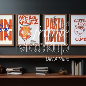 May include: Four framed art prints with brown wooden frames. The prints feature bold orange text and illustrations on a white background. The prints say "GIN GIN", "APEROL SPRITZ", "PASTA LOVER", and "COFFEE LOVER CLUB".