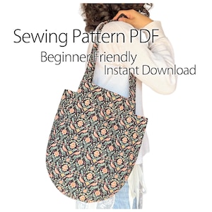 Könnte beinhalten: Eine schwarze Tragetasche mit einem Blumen- und Vogelmuster. Die Tasche hat eine abgerundete Form und lange Träger. Der Text auf dem Bild lautet "Sewing Pattern PDF, Beginner Friendly, Instant Download."