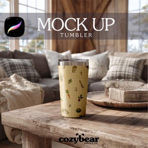 May include: A stainless steel tumbler with a yellow gingham pattern featuring gardening tools and vegetables. The tumbler has a silver lid and is displayed on a wooden table. The words "MOCK UP TUMBLER" are above the tumbler.