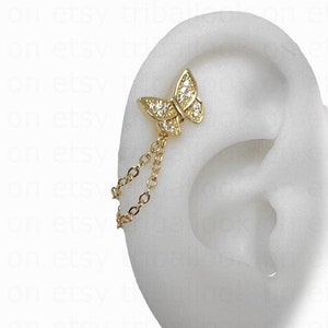 Piercing bijou hélix ou conque avec ou sans chaîne, calibre 18, 6 mm de largo, papillon doré y micropavé de óxidos de circonio (37 pb)