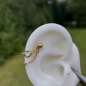 Helix oder Muschelring mit Doppelketten und Herz (22 m)