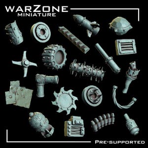 May include: A collection of grey resin miniature parts labeled WARZONE MINIATURE and PRE-SUPPORTED. The set includes various mechanical components such as spiked wheels, gears, pipes, a rocket, metal plates, vents, and ammunition clips for assembly.