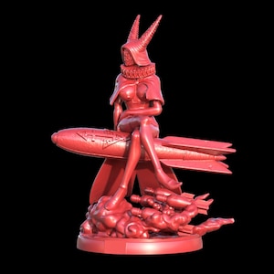 Puede incluir: Figura roja de una mujer con un atuendo con capucha y cuernos, sentada en un cohete. La figura está sobre una base redonda con un diseño de nube y cohetes adicionales. El fondo es negro.