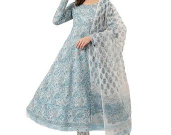 May include: A light blue long-sleeved dress featuring a white and grey floral block print pattern. The dress has a round neckline and a flared skirt silhouette. It is paired with a matching sheer white dupatta scarf with a blue floral border print.