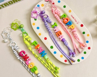 Porte-clés clochette personnalisé, breloque de sac à main étoile colorée personnalisée, breloque de sac à dos en paracorde à grelots, cadeau d'anniversaire pour elle