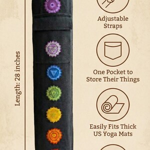 May include: A black cylindrical yoga mat bag with seven embroidered chakra symbols in a vertical row. The bag measures 28 inches in length and 6.5 inches in diameter. Features include adjustable straps, an external pocket, and handmade construction.