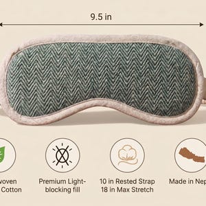 May include: A sleep mask made of handwoven organic cotton, 24 cm wide and 10 cm high. The mask has a green herringbone pattern and a light-blocking fill. The strap is 25 cm at rest and stretches to 46 cm. Made in Nepal.