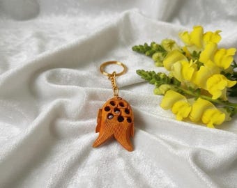 キーホルダーについた動く木の魚 - Etsy 日本
