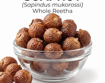May include: A clear glass bowl filled with brown, wrinkled soapnut berries, also known as Sapindus mukorossi or whole Reetha. The text SOAPNUT (Sapindus mukorossi) Whole Reetha is printed in black above the bowl of dried fruit.