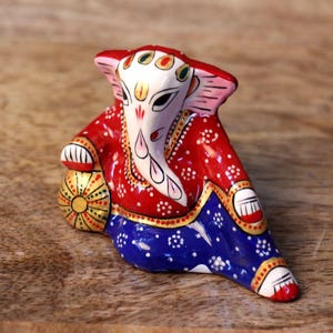 ganesha idol close up lying ganpati statue colorful decorative piece