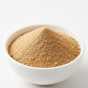 Organic ashwagandha powder close-up in bowl – natural herbal powder for stress relief and strength