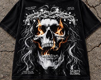 May include: A black short-sleeve t-shirt featuring a graphic of a skull wearing a crown of thorns with flames in the eye sockets and mouth. Text includes DEATH BEFORE DISHONOR, MADE IN THE WEST, PROTOCOL LIFE, SAINTS TEARS, THERE WILL BE NO FIRE BURNING, and SAINTS GLOBAL.