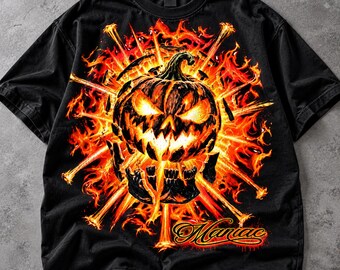 May include: A black short-sleeve t-shirt featuring a graphic print of a glowing jack-o'-lantern surrounded by bright orange and yellow flames and radiating light beams. The word Maniac is printed in a stylized script font at the bottom.