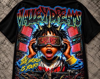 May include: A black t-shirt featuring a vibrant graphic print of a person wearing futuristic goggles with the text "SAINTS" on the lenses. Above the figure, the text "VALLEY DREAMS" appears, and below, the text "THE WORLD IS YOURS" is visible.