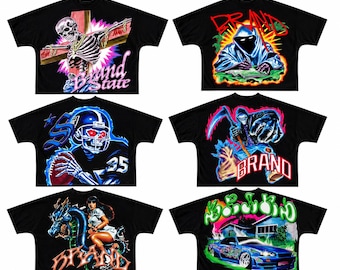 May include: Six black t-shirts featuring graphic prints. Designs include a skeleton on a cross, a hooded figure writing, a skeleton football player, a grim reaper with a scythe, a person riding a dragon, and a blue sports car with text.