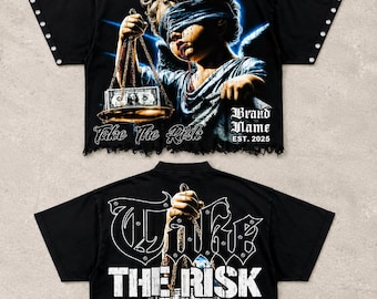 May include: A black short-sleeve shirt with a distressed hem and silver studs on the collar and sleeves. The front features a blindfolded angel holding a scale with money and the text Take The Risk Brand Name EST. 2025. The back displays TAKE THE RISK.