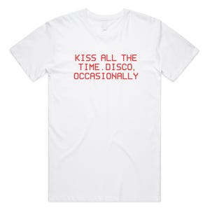 May include: White t-shirt with the red text "KISS ALL THE TIME. DISCO, OCCASIONALLY" printed across the front. The shirt has short sleeves and a crew neck.