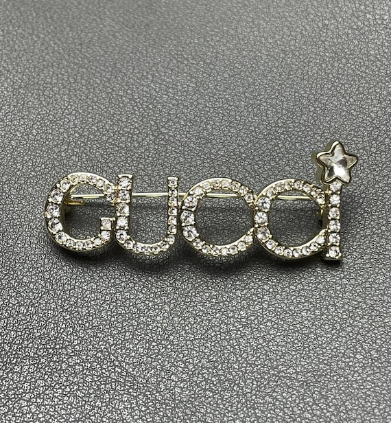 ヴィンテージゴールドレトロブローチ グッチ ビッグロゴ ストーン付き