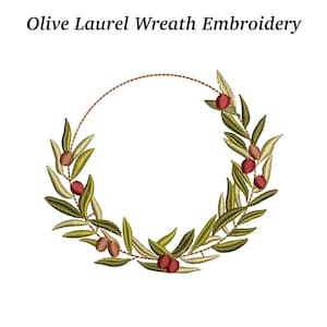 May include: Olive laurel wreath embroidery design. The design features a circular wreath of olive branches with green leaves and red olives. The text "Olive Laurel Wreath Embroidery" is at the top of the image.