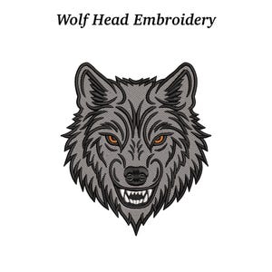 May include: Embroidered wolf head design with the text "Wolf Head Embroidery". The wolf has grey fur, black outlines, and orange eyes. The design features sharp teeth and a detailed, textured appearance.