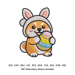 May include: An embroidered design of a Shiba Inu puppy wearing a bunny ear hat and holding a colorful Easter egg. The design includes the text "PDF Embroidery Pattern Included".