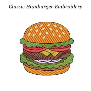 Op de afbeelding: Geborduurd beeld van een klassieke hamburger. De burger heeft een sesambroodje, sla, tomaat, een hamburger, kaas en rode ui. De tekst "Classic Hamburger Embroidery" staat bovenaan.