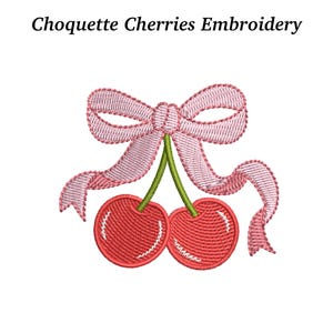 May include: An embroidered design featuring two red cherries with green stems, topped with a pink bow. The text "Choquette Cherries Embroidery" is displayed above the cherries.