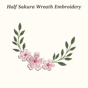 May include: Embroidered half sakura wreath design. The design features three pink flowers with dark pink centers and green leaves. The text "Half Sakura Wreath Embroidery" is at the top.