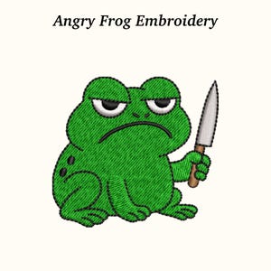 May include: Green embroidered frog with a grumpy expression, holding a knife. The frog has black eyes and a black frown. The text "Angry Frog Embroidery" is above the frog.