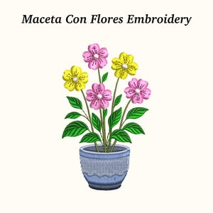 May include: An embroidered design of a potted plant with pink and yellow flowers and green leaves. The pot is blue with a textured pattern. The text "Maceta Con Flores Embroidery" is above the image.