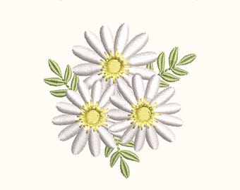 May include: An embroidered design of three white daisies with yellow centres and green leaves. The text "Forget-Me-Not Embroidery" is displayed above the floral arrangement.