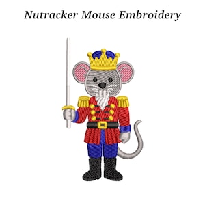 May include: An embroidered design of a mouse dressed as a Nutcracker soldier, holding a sword. The mouse wears a red jacket with gold accents, blue pants, and a gold crown. The text "Nutracker Mouse Embroidery" is above the image.