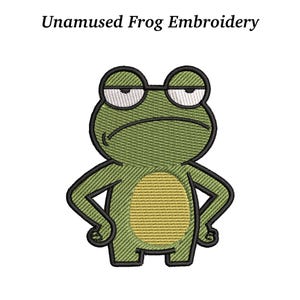 May include: An embroidered design of a cartoon frog with a grumpy expression. The frog is green with a yellow belly and black outlines. The text "Unamused Frog Embroidery" is above the frog.