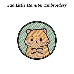 May include: Embroidered patch featuring a sad hamster with folded arms, set within a black circle on a light green background. The text "Sad Little Hamster Embroidery" is above the image.