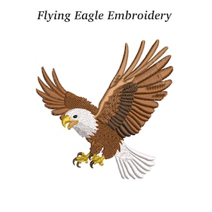 May include: An embroidered design of a flying eagle with outstretched wings. The eagle features brown and white feathers, a yellow beak, and yellow talons. The text "Flying Eagle Embroidery" is above the eagle.