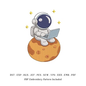 May include: An embroidered design featuring an astronaut sitting on a planet, working on a laptop. The astronaut is wearing a white spacesuit and helmet with a blue visor. The planet is orange with craters, and there are yellow stars in the background. The text at the bottom says "PDF Embroidery Pattern Included."