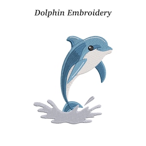 May include: Embroidered image of a blue dolphin leaping out of water. The dolphin has a white belly and a black eye. The text "Dolphin Embroidery" is above the dolphin.