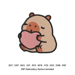 May include: An embroidered design of a cartoon bear holding a pink heart. The bear is tan and brown with black outlines. The image includes the text "PDF Embroidery Pattern Included".
