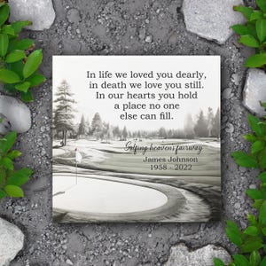 May include: A black and white image of a golf course with a quote about life and death. The quote reads: "In life we loved you dearly, in death we love you still. In our hearts you hold a place no one else can fill." Below the quote is the text "Golfing heavens fairway" and "James Johnson 1958-2022".