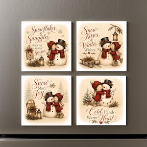 May include: A set of four square magnets featuring illustrations of a child in a red coat hugging a snowman. The text reads Snowflakes & Snuggles, Snow Kisses & Winter Wishes, Snow Much Joy, and Cold Hands - Warm Heart with winter motifs.