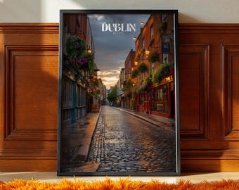 May include: Framed print depicting a Dublin street scene with cobblestones and buildings. The sky is a blend of orange and grey. The print features the word "DUBLIN" at the top.