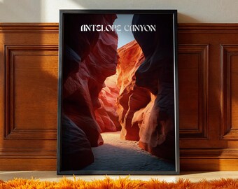 May include: Framed print featuring a photograph of Antelope Canyon. The image showcases the canyon's red and orange sandstone walls, with the text "ANTELOPE CANYON" in white at the top. The print is in a black frame, resting on a floor with an orange rug.