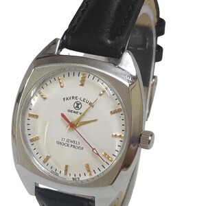 May include: A silver Favre-Leuba Geneve watch with a white face, gold hands, and a red second hand. The watch has a black leather strap and the text "17 Jewels Shock Proof". The watch is a vintage style.