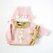 Reviewed by Anonymous reviewed Knitted sweater and cap in pink with felt flowers. 100% wool. READY TO SHIP in size Newborn.