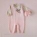 christelle harris reviewed Knitted overalls in pink with felt flowers, matching shoes. 100% merino wool. READY TO SHIP size newborn.