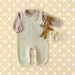 kblackad reviewed Knitted overalls in pearl with a bird, matching shoes. 100% merino wool. READY TO SHIP size newborn.