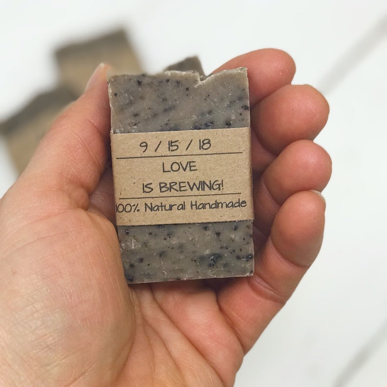May include: A brown bar of soap with a brown paper label that reads "9/15/18 Love is Brewing! 100% Natural Handmade".