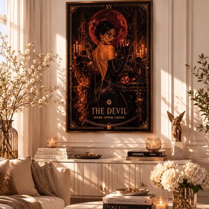 May include: A framed wall art print depicting a tarot card titled The Devil, featuring a figure in a black dress and gloves holding a glass against a dark red moon background, with the text XV, The Devil, Desire, Power, Choice, and a chain.